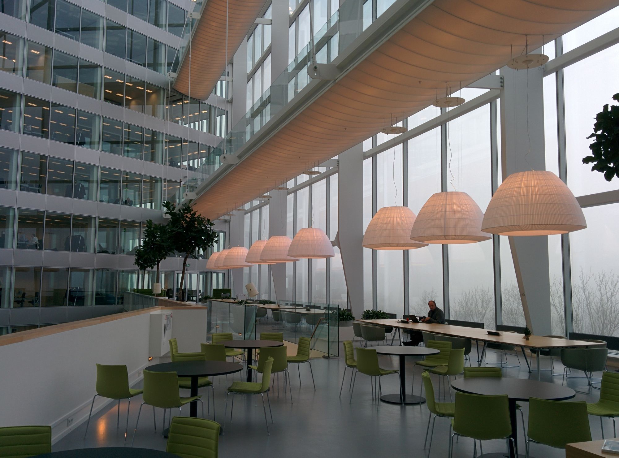 Bright office atrium where people meet