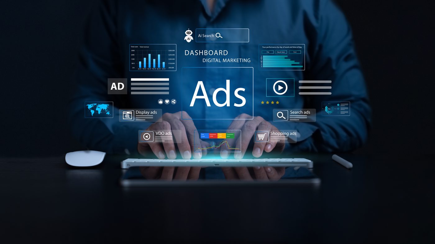 Hands planning a digital advertising campaign on a tablet